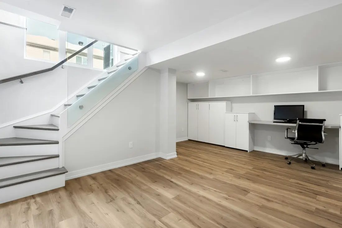Bright finished basement room used as a home office